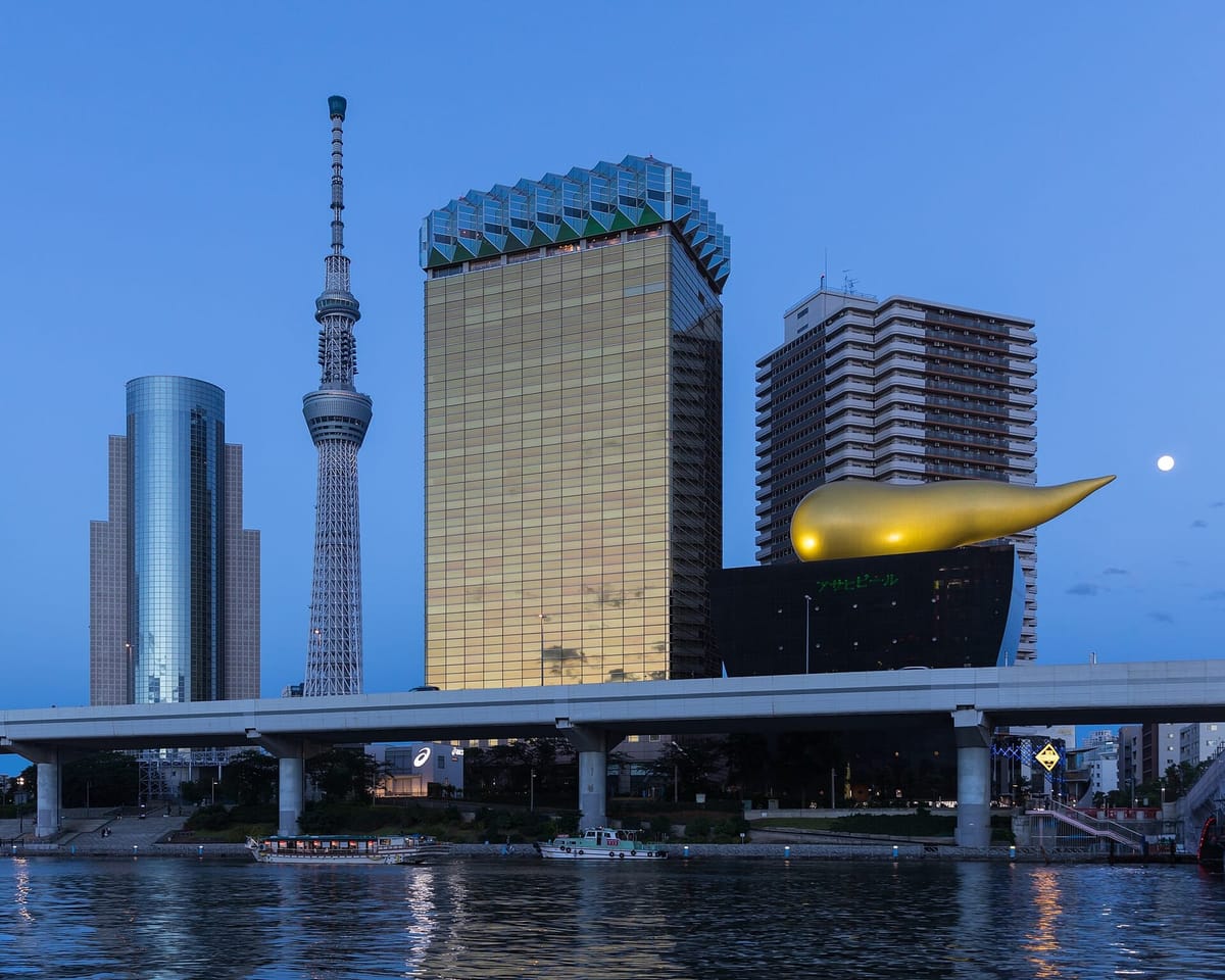 The Asahi headquarters, the golden Flamme d'Or and Skytree at blue hour