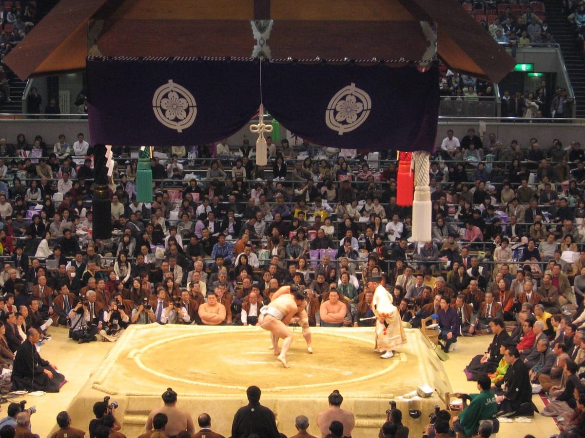 A clay sumo ring with its straw-bale boundary, swept and ready for a bout