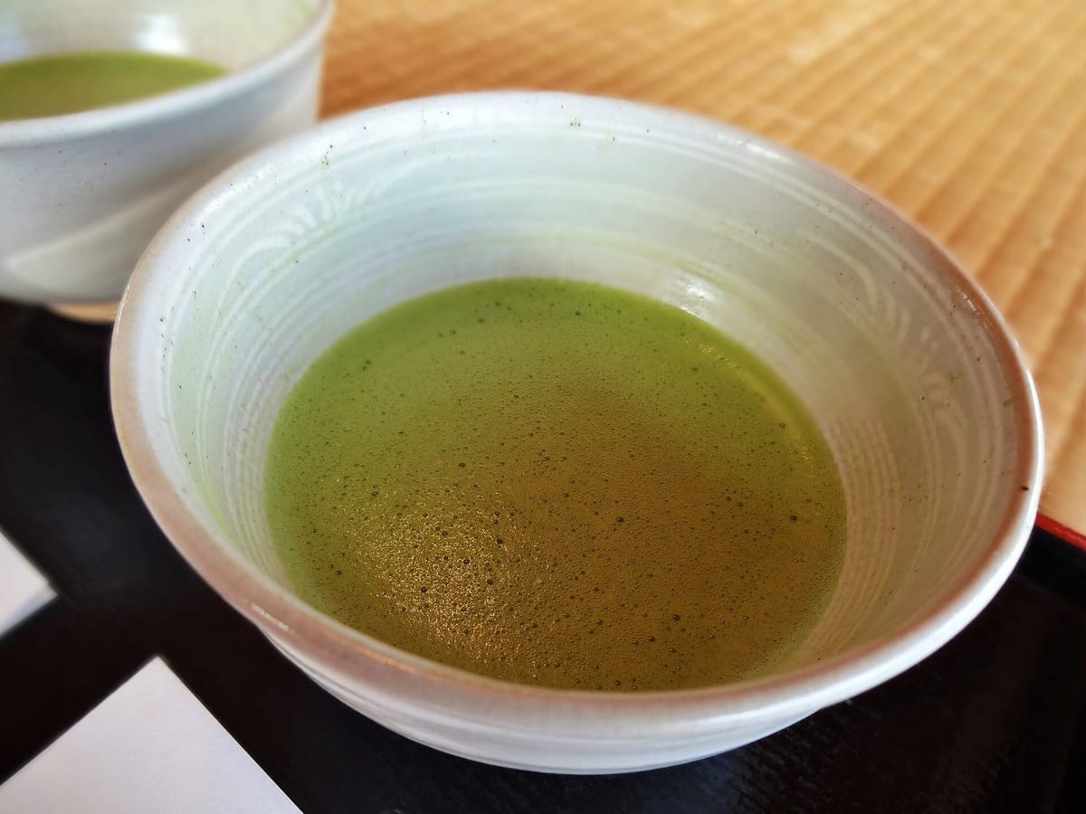 A bowl of whisked matcha served during a Japanese tea ceremony