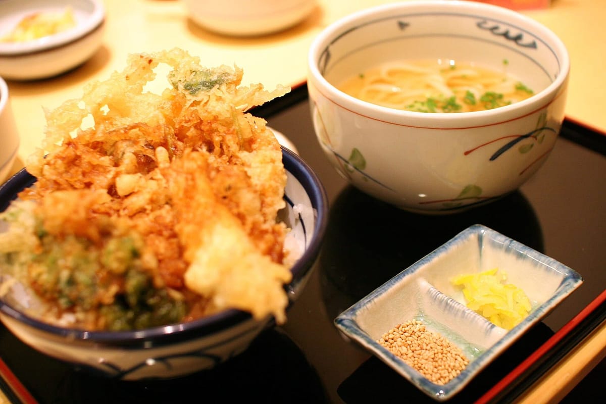 A tendon rice bowl of battered tempura served with a bowl of udon