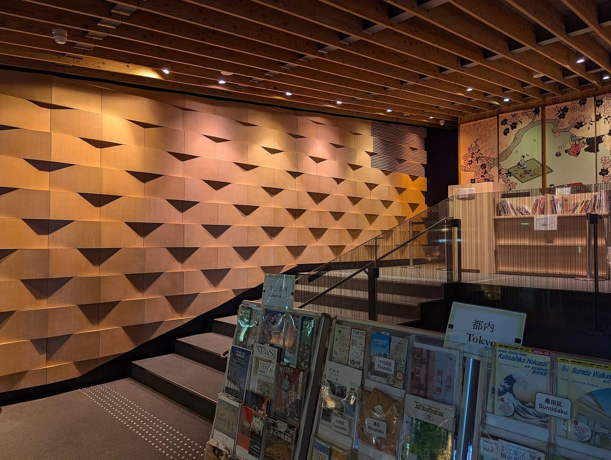 The Asakusa Culture Tourist Information Center, its floors stacked like wooden houses under sloping roofs